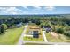 Expansive aerial view of a property highlighting the home, in-ground pool, and spacious backyard with property lines at 1302 Reading Ct, Burlington, NC 27217