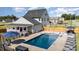 Stunning backyard with a private in-ground pool and stylish lounge area for outdoor entertaining at 1302 Reading Ct, Burlington, NC 27217