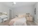Comfortable bedroom with ceiling fan, vanity, and soft lighting for a relaxing atmosphere at 1302 Reading Ct, Burlington, NC 27217