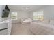 This bedroom features soft, neutral colors, two beds, and a ceiling fan for added comfort at 1302 Reading Ct, Burlington, NC 27217