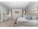 Bright bedroom with neutral palette, large windows, and comfortable king bed at 1302 Reading Ct, Burlington, NC 27217