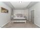 Calm and inviting bedroom with tray ceiling, soft carpet, and neutral decor at 1302 Reading Ct, Burlington, NC 27217