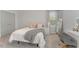 Bright bedroom with a plush bed, a window with natural light, and a stylish desk area at 1302 Reading Ct, Burlington, NC 27217