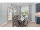 The breakfast nook has a window, door to the outside, and a table for four at 1302 Reading Ct, Burlington, NC 27217