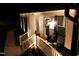 Charming front porch with cozy seating and elegant lighting near front door at 1302 Reading Ct, Burlington, NC 27217
