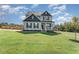 Charming two-story home with a manicured front lawn and welcoming porch, set in a peaceful neighborhood at 1302 Reading Ct, Burlington, NC 27217