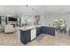 Open concept floor plan showing the island with seating as it connects to the living room at 1302 Reading Ct, Burlington, NC 27217
