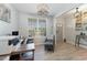 Bright home office featuring a window, neutral tones, modern lighting, and ample workspace at 1302 Reading Ct, Burlington, NC 27217