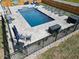 Beautiful in-ground pool and patio, complete with lounge chairs, hot tub, and outdoor seating at 1302 Reading Ct, Burlington, NC 27217