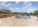 Beautiful backyard pool with lounge chairs, umbrellas, privacy fence, and stamped concrete patio at 1302 Reading Ct, Burlington, NC 27217