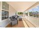 Relax on this spacious porch with comfortable seating and views of the backyard at 1302 Reading Ct, Burlington, NC 27217