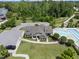Aerial view of the community clubhouse, pool and amenities with ample parking and green space at 1308 Mackinaw Dr, Wake Forest, NC 27587