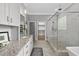 Spacious bathroom with granite countertops, walk-in shower and separate tub at 1308 Mackinaw Dr, Wake Forest, NC 27587