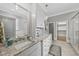 Elegant bathroom with granite countertops, white cabinetry, and tile flooring at 1308 Mackinaw Dr, Wake Forest, NC 27587