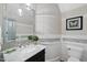 Elegant powder room featuring a marble countertop, decorative tile accents, and stylish lighting fixtures at 1308 Mackinaw Dr, Wake Forest, NC 27587