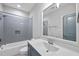 Contemporary bathroom featuring subway tile in shower and vanity with modern fixtures at 1308 Mackinaw Dr, Wake Forest, NC 27587