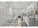 Bright bathroom with glass shower, soaking tub, and dual granite vanities at 1308 Mackinaw Dr, Wake Forest, NC 27587
