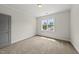 Cozy bedroom with natural light, plush carpeting, and neutral color palette at 1308 Mackinaw Dr, Wake Forest, NC 27587