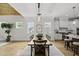 Dining room with hardwood floors, neutral walls, lots of windows and easy access to the kitchen at 1308 Mackinaw Dr, Wake Forest, NC 27587