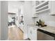 Modern kitchen featuring stainless steel appliances, granite countertops, white cabinetry and open layout at 1308 Mackinaw Dr, Wake Forest, NC 27587