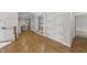 Spacious living area showcasing hardwood floors, built-in shelving, and elegant trim work at 1308 Mackinaw Dr, Wake Forest, NC 27587