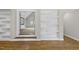Open living room featuring built-in shelving, hardwood floors, and natural light at 1308 Mackinaw Dr, Wake Forest, NC 27587