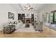 Spacious living room features coffered ceilings, a stone fireplace with built-in shelves, and hardwood floors at 1308 Mackinaw Dr, Wake Forest, NC 27587