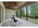 Inviting screened porch with wood ceiling, ceiling fan and comfortable seating at 1308 Mackinaw Dr, Wake Forest, NC 27587