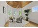 Cozy sitting area with natural light, two armchairs, chandelier, and hardwood floors at 1308 Mackinaw Dr, Wake Forest, NC 27587