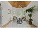 Bright sitting area with wooden ceiling, modern chandelier, and neutral decor at 1308 Mackinaw Dr, Wake Forest, NC 27587