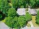 Birds eye view of lush landscape surrounding house; mature trees shade the roof at 1416 Dunbar Ct, Cary, NC 27511