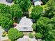 Birds eye view of lush landscape surrounding house; mature trees shade the roof at 1416 Dunbar Ct, Cary, NC 27511