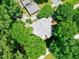 Overhead shot of a charming house surrounded by lush trees in a quiet neighborhood at 1416 Dunbar Ct, Cary, NC 27511