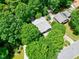 An aerial view of a home surrounded by mature trees showcasing the property's privacy at 1416 Dunbar Ct, Cary, NC 27511