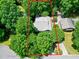 Overhead shot of a charming house surrounded by lush trees in a quiet neighborhood at 1416 Dunbar Ct, Cary, NC 27511