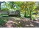 Exterior view of home's deck and lush backyard with mature trees at 1416 Dunbar Ct, Cary, NC 27511