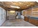 Basement workshop features utility sink, workbench area, and space for storage and projects at 1416 Dunbar Ct, Cary, NC 27511