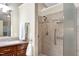Updated bathroom features a custom shower with safety bar and modern fixtures at 1416 Dunbar Ct, Cary, NC 27511