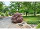 View of a well-manicured lawn with a Japanese Maple tree and stone walkway at 1416 Dunbar Ct, Cary, NC 27511