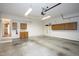 Two car garage with storage cabinets, workbench area, and room for vehicle parking at 1416 Dunbar Ct, Cary, NC 27511