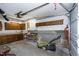 Spacious garage features storage cabinets and a lawn mower at 1416 Dunbar Ct, Cary, NC 27511