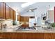 Kitchen with granite countertops, stainless steel appliances, and a ceiling fan at 1416 Dunbar Ct, Cary, NC 27511