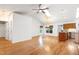 Open-concept living space with vaulted ceilings, skylight, hardwood floors, and dining area at 1416 Dunbar Ct, Cary, NC 27511