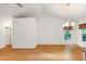 Spacious living room with hardwood floors, chandelier, and natural light at 1416 Dunbar Ct, Cary, NC 27511