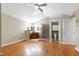 Large main bedroom boasts hardwood floors, ceiling fans, ensuite bath, and private toilet room at 1416 Dunbar Ct, Cary, NC 27511