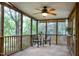 Relax on this screened porch, with ceiling fan, outdoor seating and tranquil views at 1416 Dunbar Ct, Cary, NC 27511