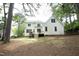 Backyard of a two-story home with a deck and stairs leading to the yard at 1605 Heritage Club Ave, Wake Forest, NC 27587