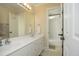 Bright bathroom featuring double vanity with tub and toilet in separate room at 1605 Heritage Club Ave, Wake Forest, NC 27587