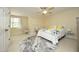 Well-lit bedroom with bright carpet, featuring a white duvet with a colorful geometric pattern at 1605 Heritage Club Ave, Wake Forest, NC 27587