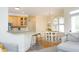 Charming dining nook with hardwood floors, stylish light fixture, and views into the adjacent kitchen at 1605 Heritage Club Ave, Wake Forest, NC 27587